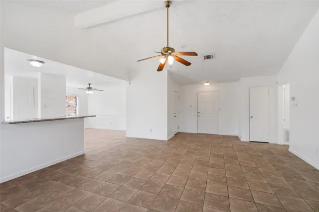 a view of a kitchen with a dishwasher and a ceiling fan