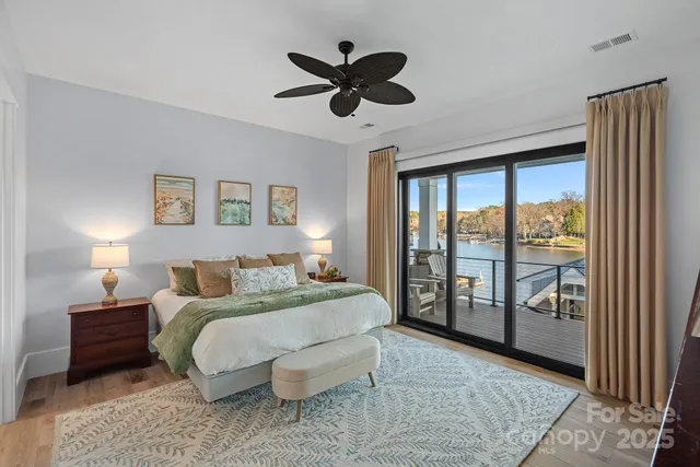 a bedroom with a large bed and a large window