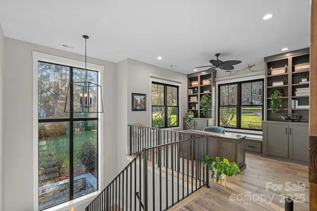a bedroom with a large bed and a large window