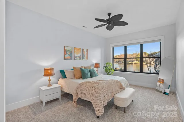 an empty room with projector and windows