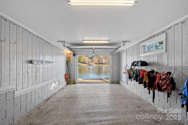 a view of house with outdoor space and lake view