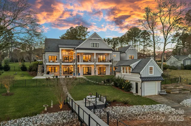 a view of a building with a swimming pool and sitting area