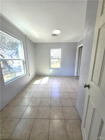 a view of an empty room and window