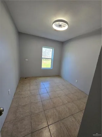 a view of an empty room and window