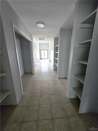 a view of hallway with window and entryway