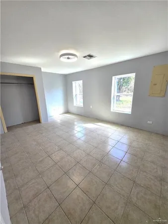a view of an empty room and window