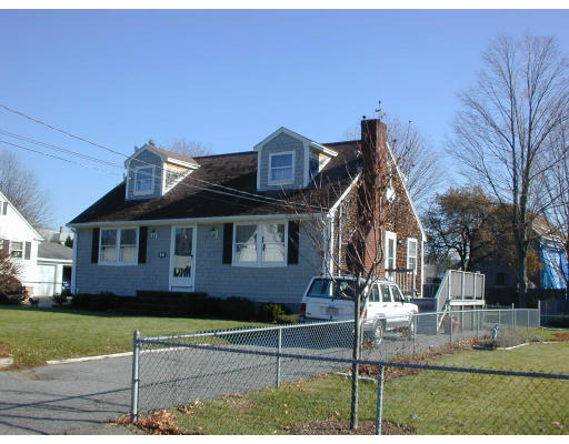 34 Friend Street Taunton, MA 02780 - Photo 2 of 8 a front view of a house with a yard
