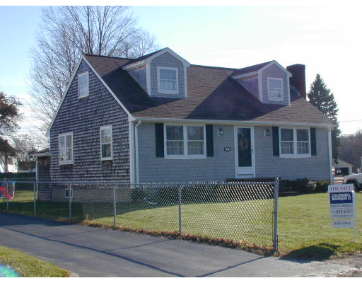 34 Friend Street Taunton, MA 02780 - Photo 3 of 8 a view of a brick house next to a yard