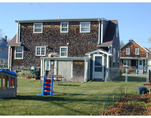34 Friend Street Taunton, MA 02780 - Photo 4 of 8 a front view of a house with a yard