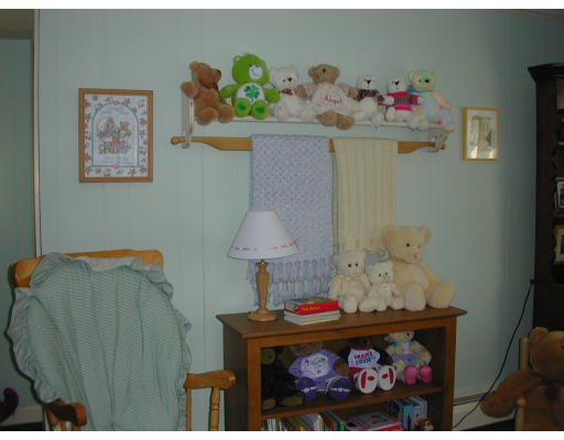 34 Friend Street Taunton, MA 02780 - Photo 5 of 8 a room with toys and painting on the wall