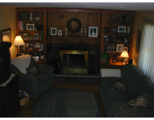 34 Friend Street Taunton, MA 02780 - Photo 7 of 8 a living room with furniture and a fireplace