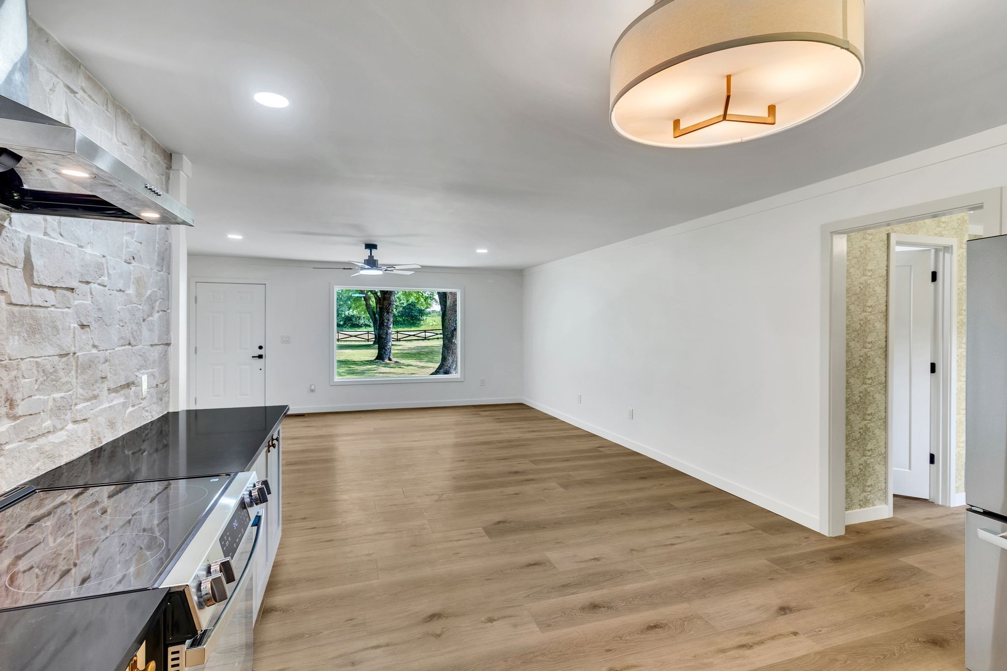 1441 Compton Road Murfreesboro, TN 37130 - Photo 12 of 26 an empty room with wooden floor and windows