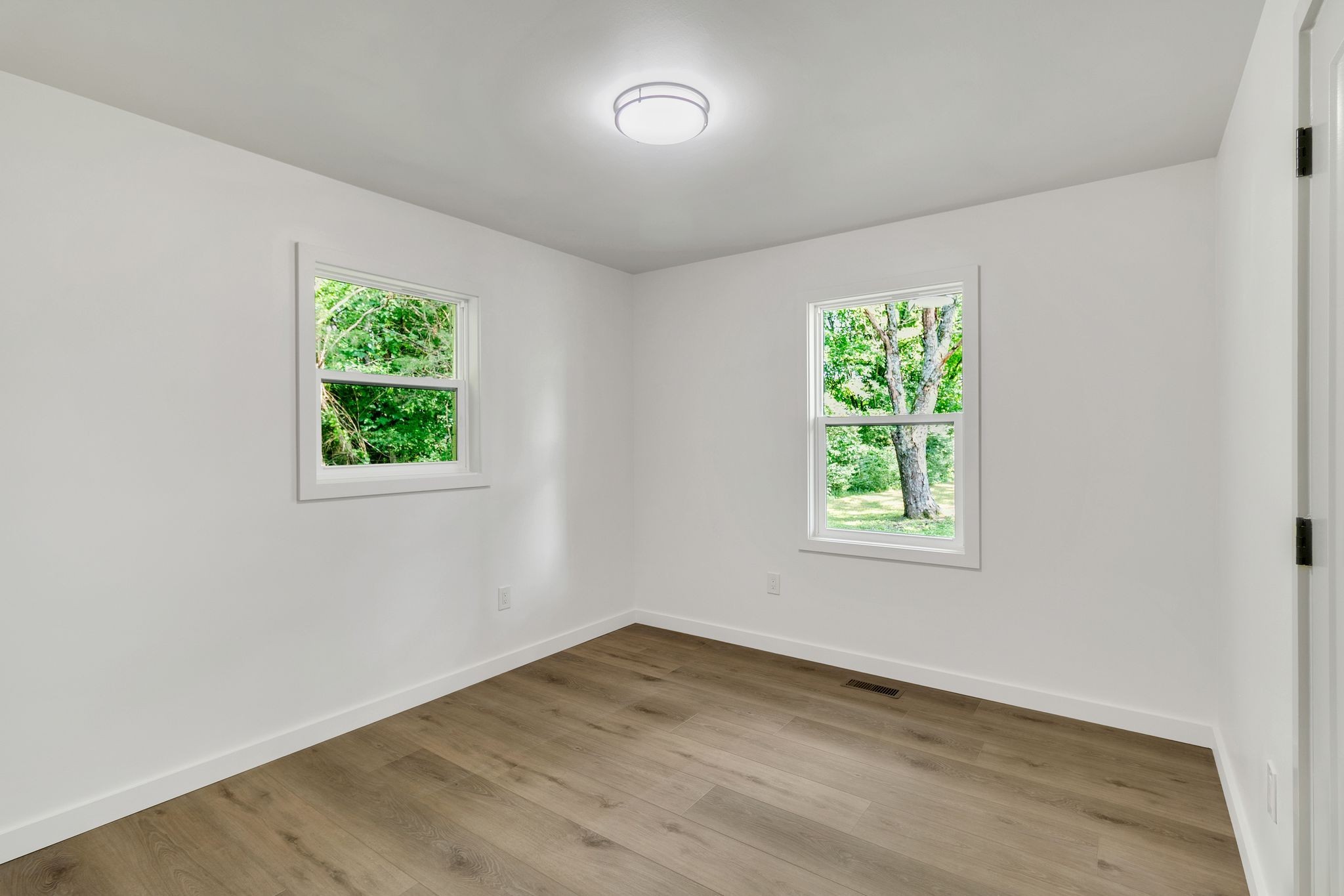 1441 Compton Road Murfreesboro, TN 37130 - Photo 17 of 26 an empty room with wooden floor and a window