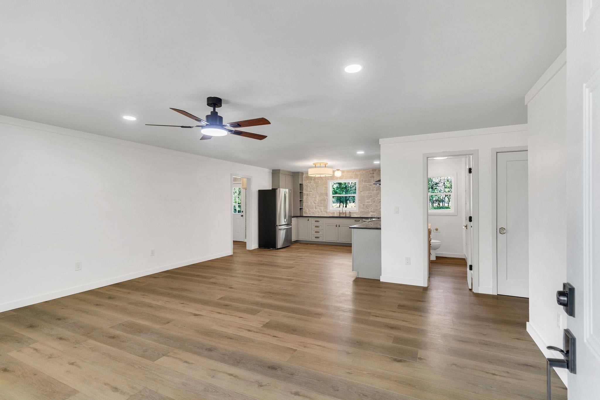 1441 Compton Road Murfreesboro, TN 37130 - Photo 5 of 26 a view of a livingroom with wooden floor and a ceiling fan