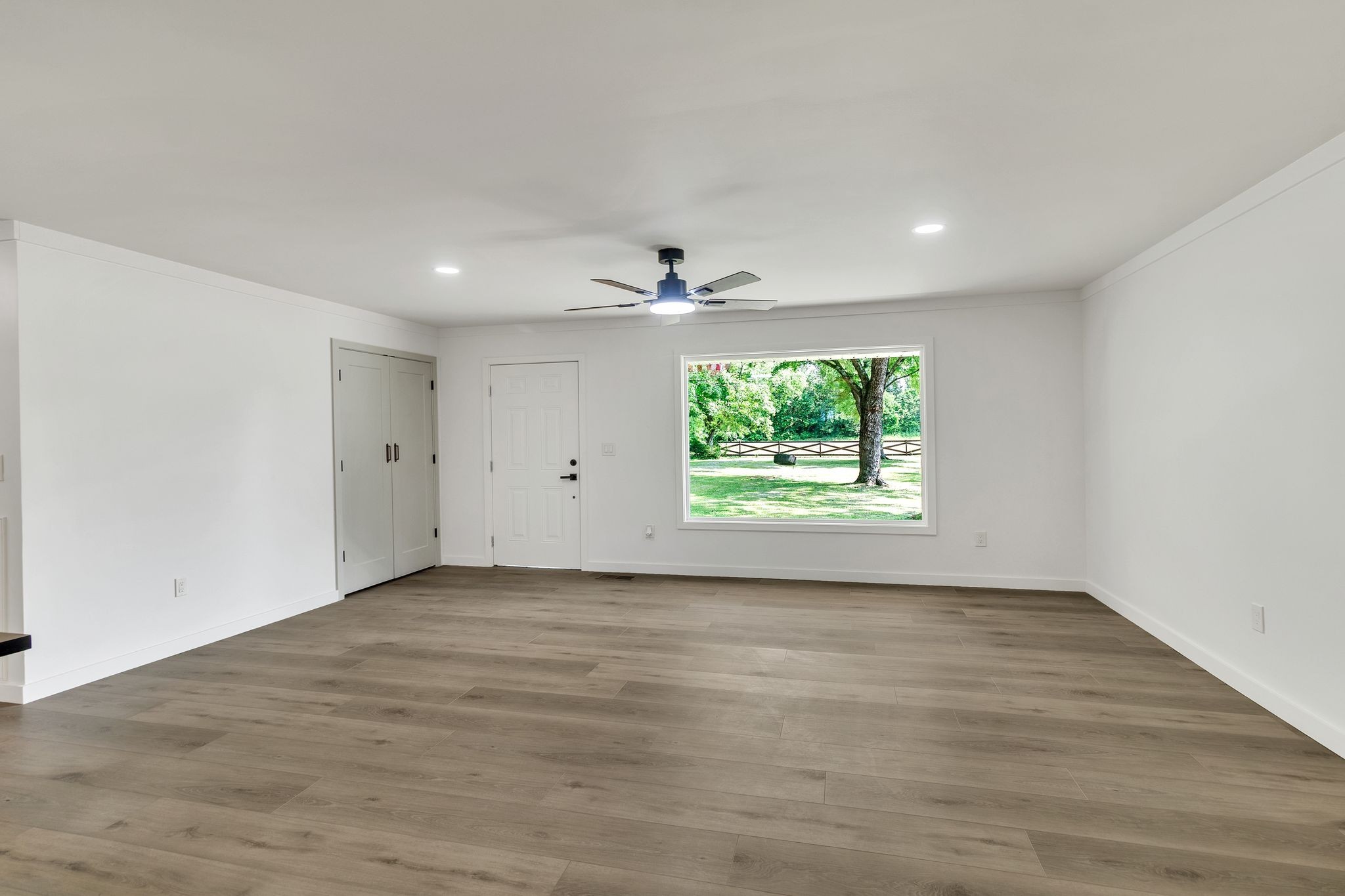 1441 Compton Road Murfreesboro, TN 37130 - Photo 6 of 26 an empty room with wooden floor and windows
