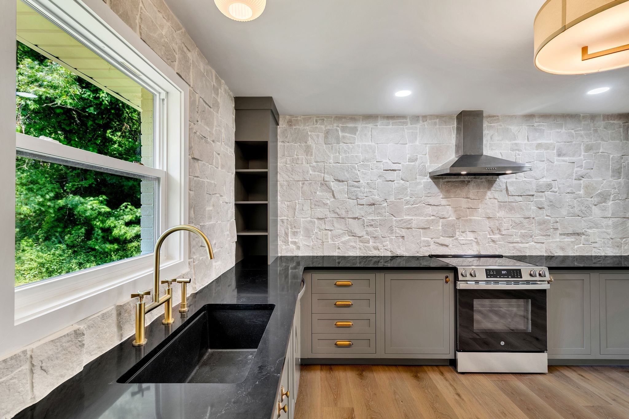 1441 Compton Road Murfreesboro, TN 37130 - Photo 10 of 26 a kitchen with a stove and a sink