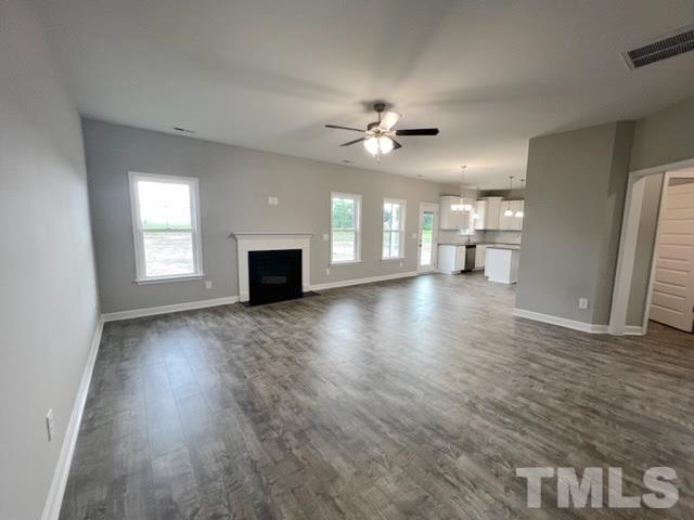 620 Ballance Road Fremont, NC 27830 - Photo 17 of 40 a view of an empty room with a fireplace and a window