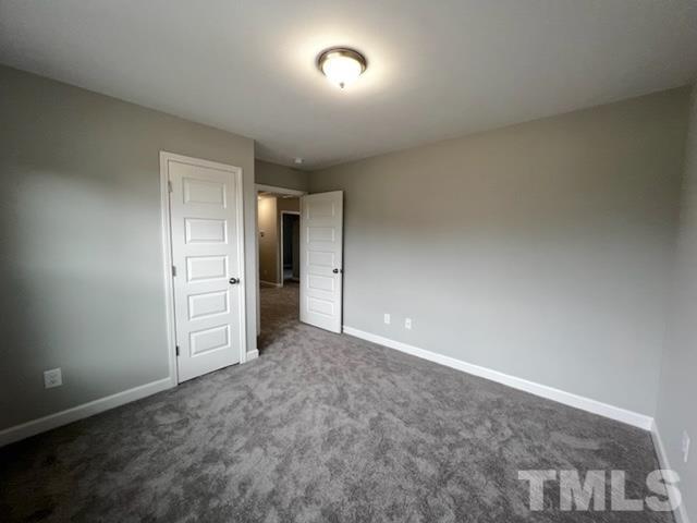 620 Ballance Road Fremont, NC 27830 - Photo 28 of 40 an empty room with closet and mirror