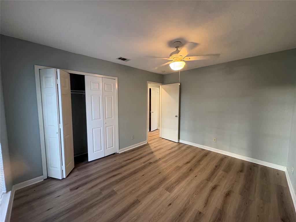 3309 Ridgeglen Circle Plano, TX 75074 - Photo 12 of 26 a view of an empty room with window and wooden floor