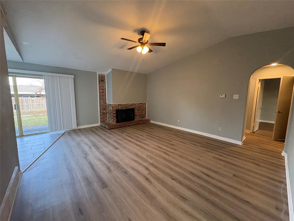 3309 Ridgeglen Circle Plano, TX 75074 - Photo 16 of 26 an empty room with wooden floor and windows