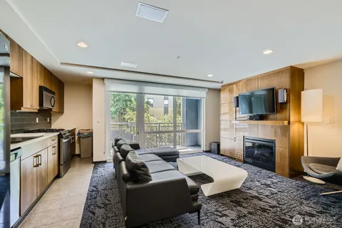 a living room with fireplace furniture and a flat screen tv