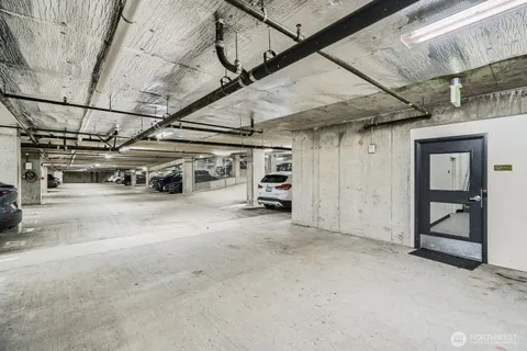 a view of parking garage with cars
