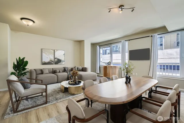 a kitchen with stainless steel appliances granite countertop a stove top oven a sink and a refrigerator