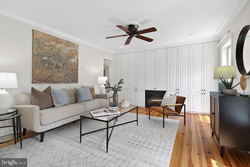 19821 Foggy Bottom Road Bluemont, VA 20135 - Photo 47 of 92 a living room with furniture a rug and a painting on the wall