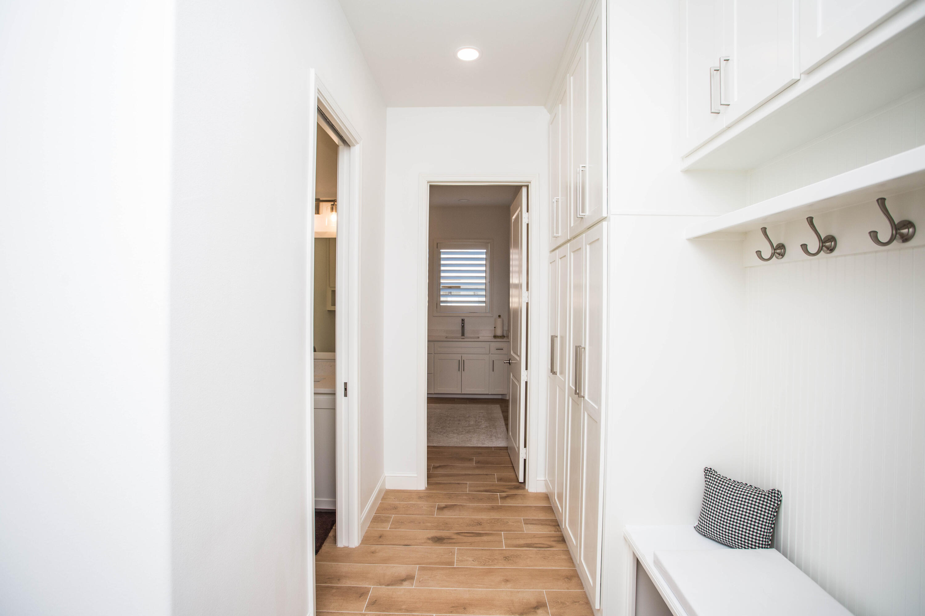 209 South Holliday Plainview, TX 79072 - Photo 19 of 29 a view of a hallway with wooden floor and a bathroom