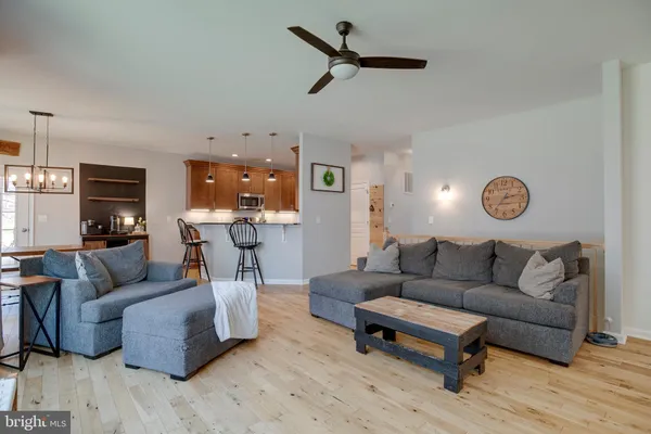a spacious bedroom with a bed and a flat screen tv