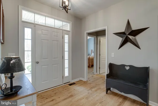 a kitchen with stainless steel appliances a refrigerator and a stove top oven