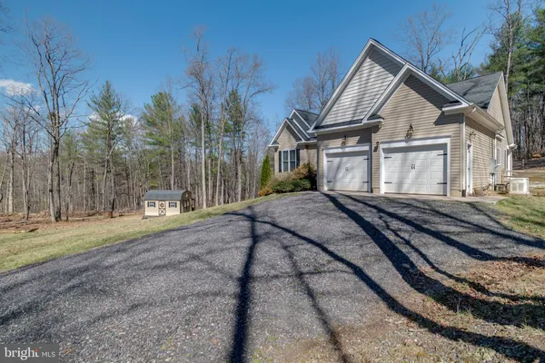 a aerial view of a house with a yard