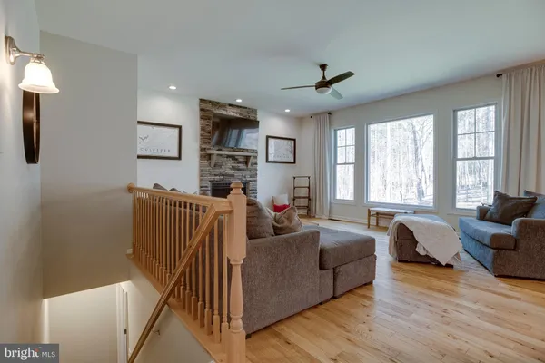 a view of a room that has a window and front door