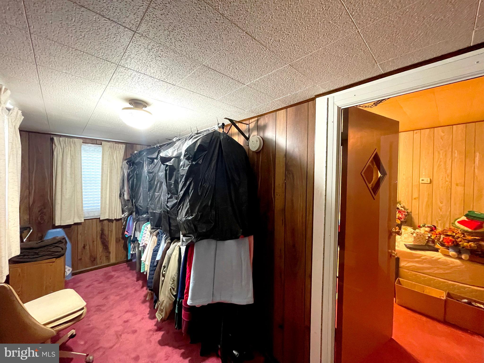 6700 Hungerford Road Bryans Road, MD 20616 - Photo 14 of 36 a bed room with a bed and a walk in closet