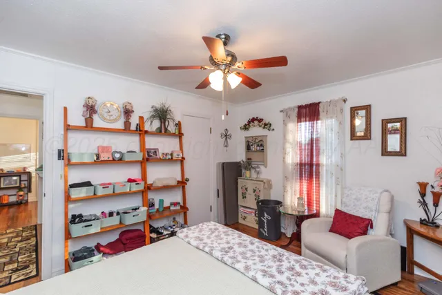 a bedroom with a bed furniture and a window