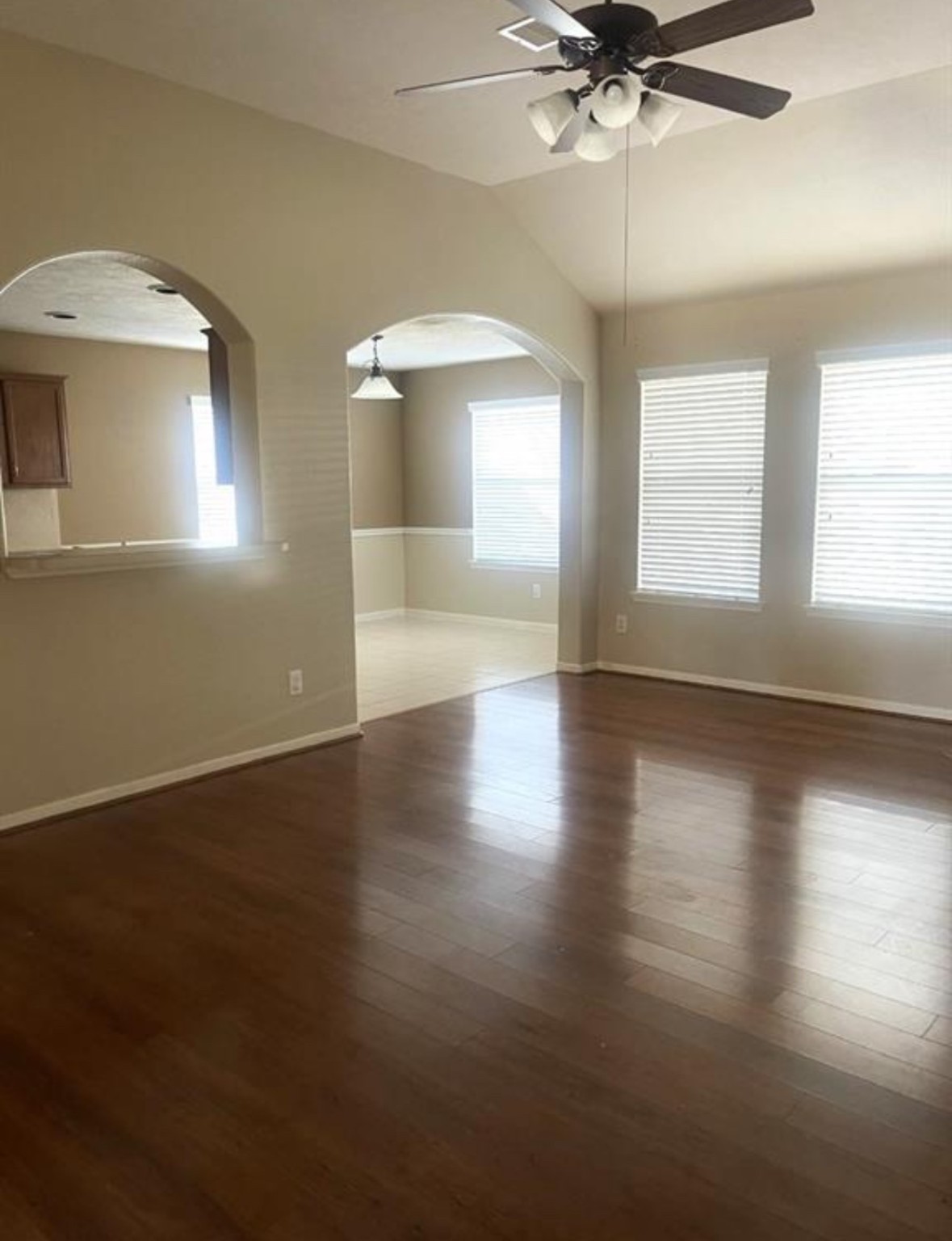 21942 Gosling Cedar Place Spring, TX 77388 - Photo 28 of 40 an empty room with wooden floor fan and windows