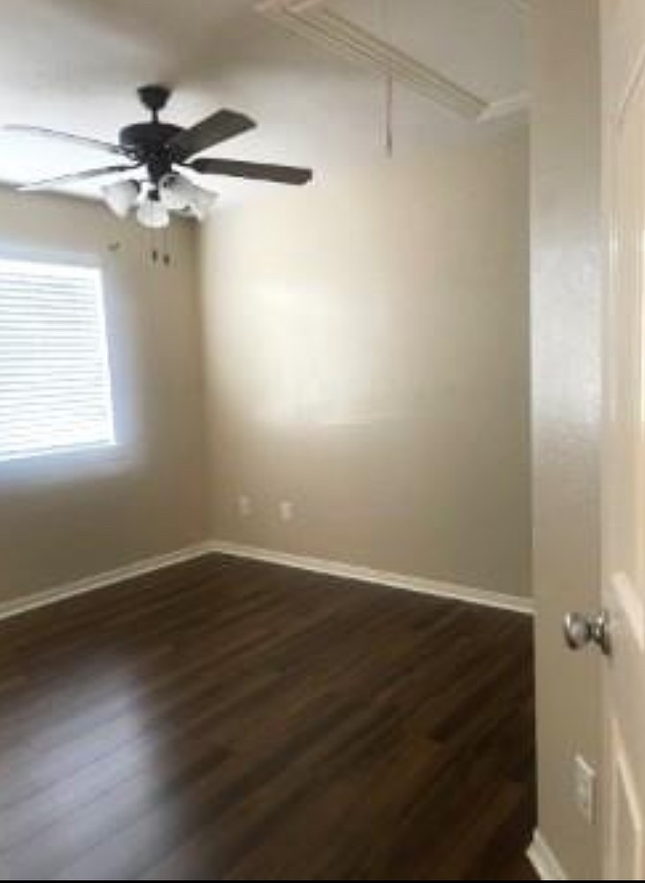 21942 Gosling Cedar Place Spring, TX 77388 - Photo 6 of 40 an empty room with wooden floor fan and windows
