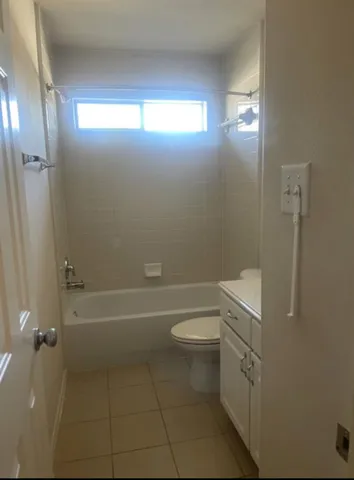 a bathroom with a bathtub toilet and sink