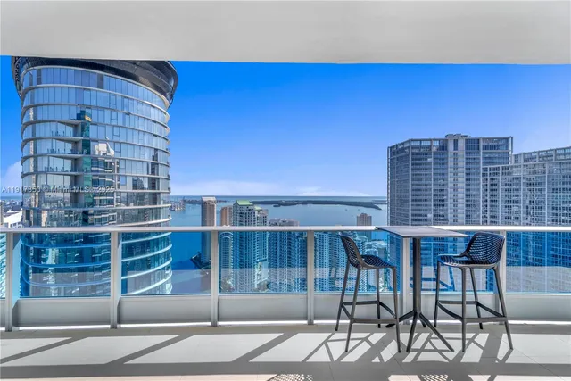 a view of balcony with furniture
