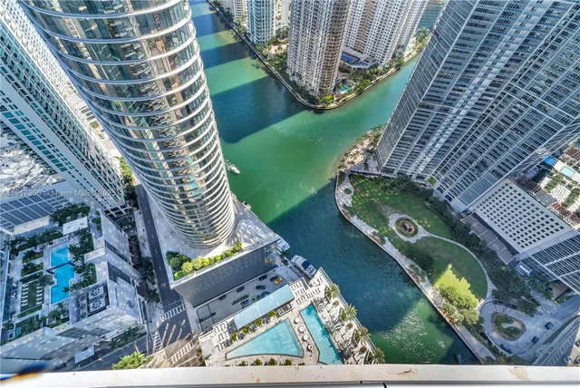 a view of balcony with wooden floor and fence