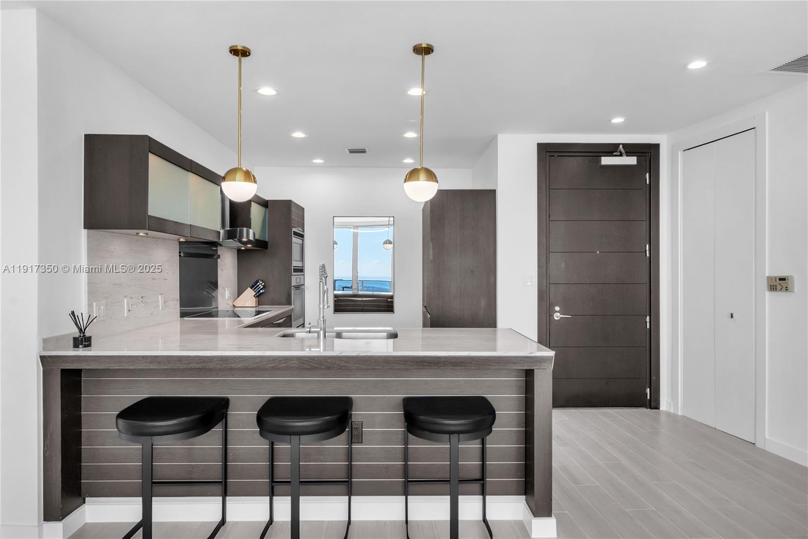 200 Biscayne Blvd Way, Unit 5103 Miami, FL 33131 - Photo 8 of 32 a view of kitchen with sink window and refrigerator