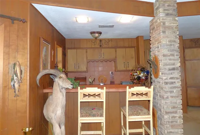 a bathroom with a sink mirror and tub
