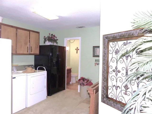 a utility room with a sink dryer and washer