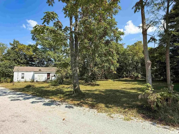 a view of a yard with an trees