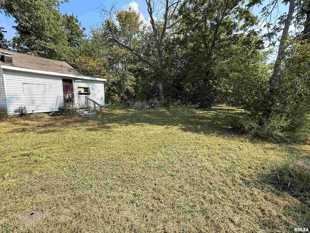 a view of a backyard of the house