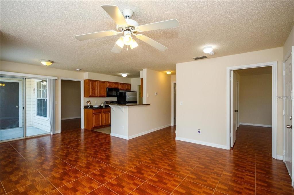 1083 South Hiawassee Road, Unit 617 Orlando, FL 32835 - Photo 3 of 12 a view of kitchen with cabinets and wooden floor