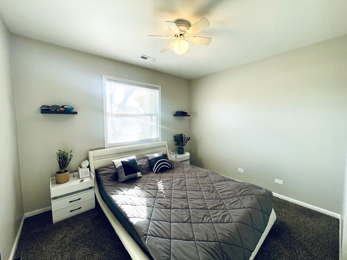 178 Stephanie Court, Unit A Bartlett, IL 60103 - Photo 11 of 12 a bedroom with a bed and window