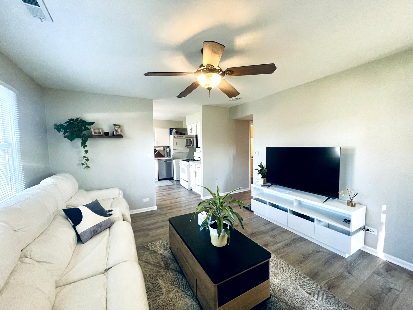 178 Stephanie Court, Unit A Bartlett, IL 60103 - Photo 3 of 12 a living room with furniture and a flat screen tv
