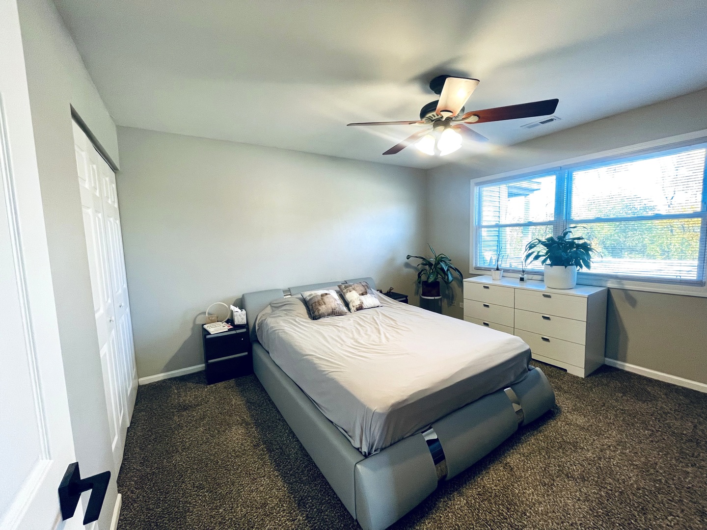 178 Stephanie Court, Unit A Bartlett, IL 60103 - Photo 10 of 12 a bed room with a bed and a ceiling fan