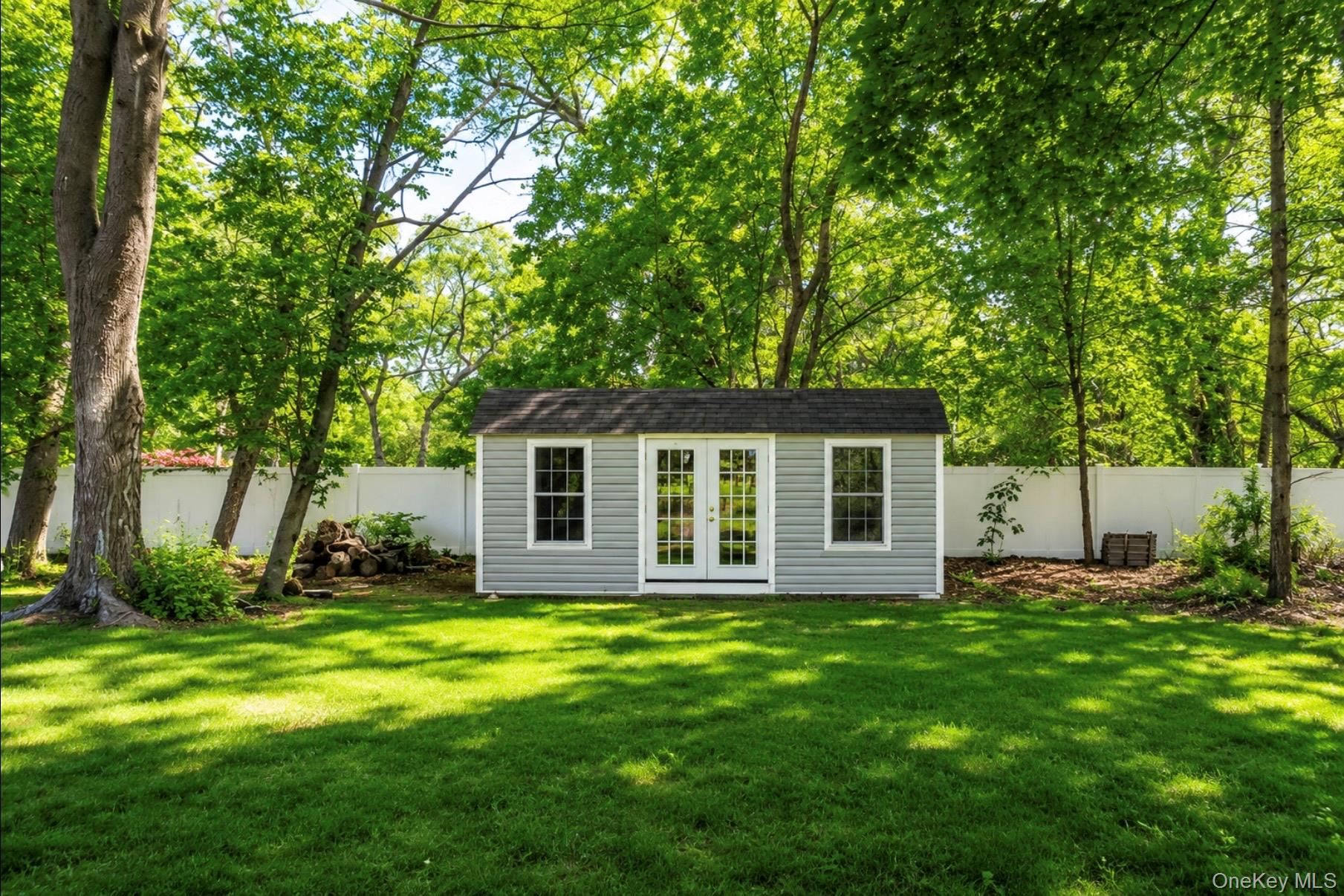 80 Mt Pleasant Road Smithtown, NY 11787 - Photo 23 of 27 a front view of house with yard and green space